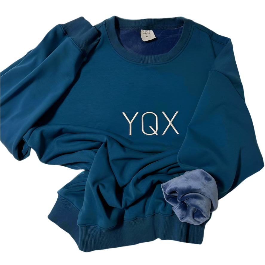 YQX Atlantic Blue center logo