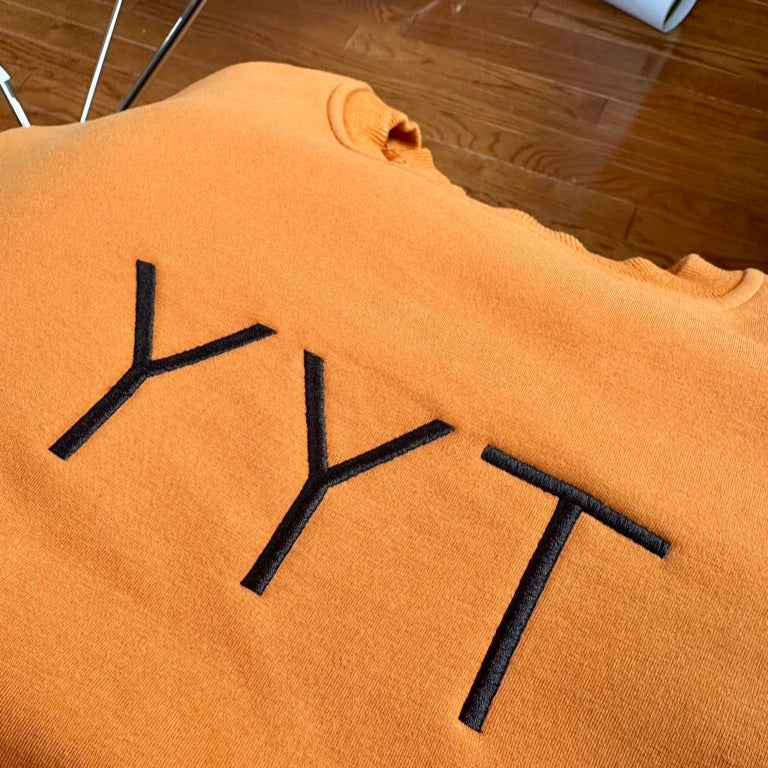 YYT Caramel center logo