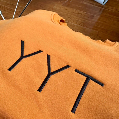 YYT Caramel center logo