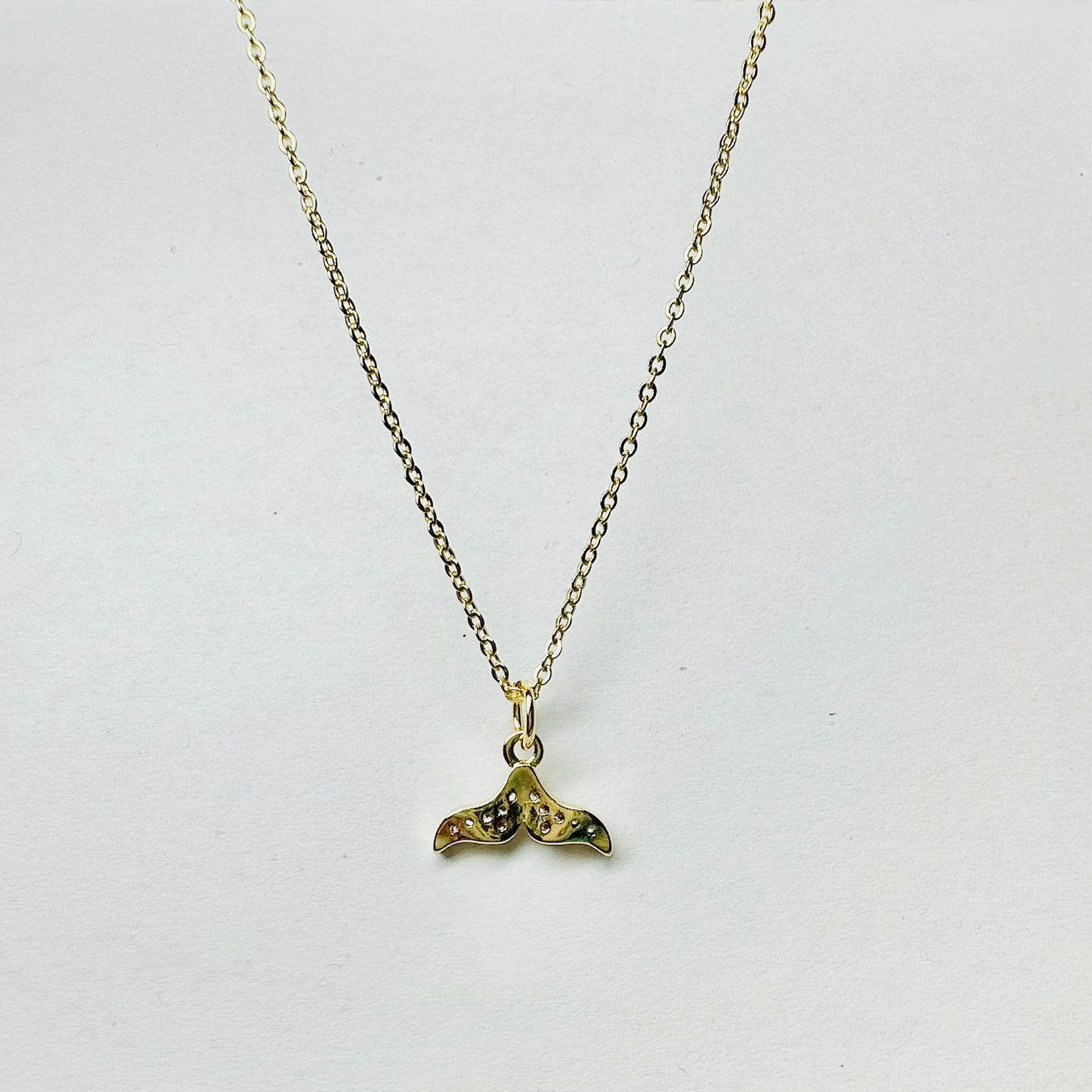 18K gold chain with 18K whale's tail charm