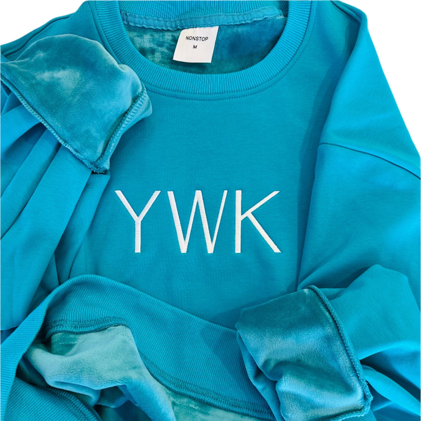 YWK Aquamarine center logo